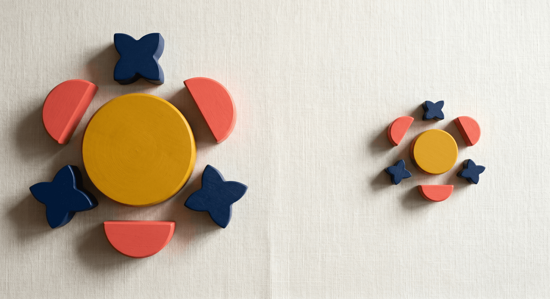 Large Bauhaus block arrangement on the left with a miniaturized version of the same arrangement on the right